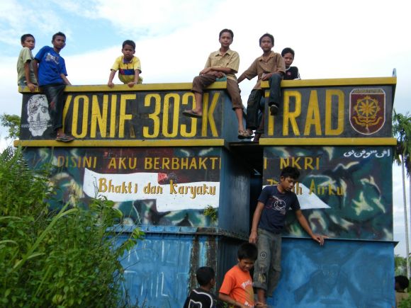 Children play at an abandoned military post, South Aceh /Edward Aspinall